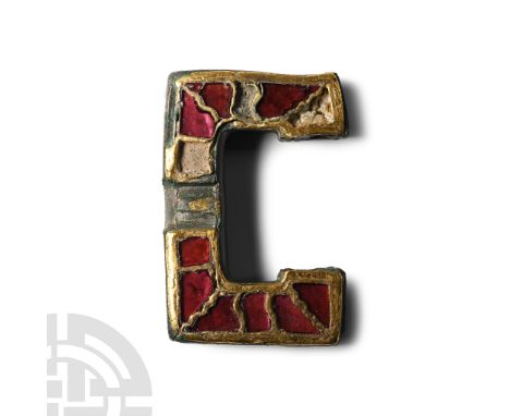 6th century A.D.. Rectangular in plan with heavy gilding to the upper face and sidewall, inset stepped cloison garnets in pre