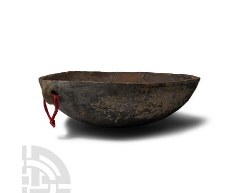 Late Bronze Age, circa 1600-1200 B.C.. Broad with low profile, rounded underside; with old collector's label 'Late Bronze Age