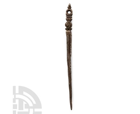 16th-18th century A.D.. With knop finial, pierced disc and floral detailing.  4.03 grams, 77 mm (3 in.). From the collection 