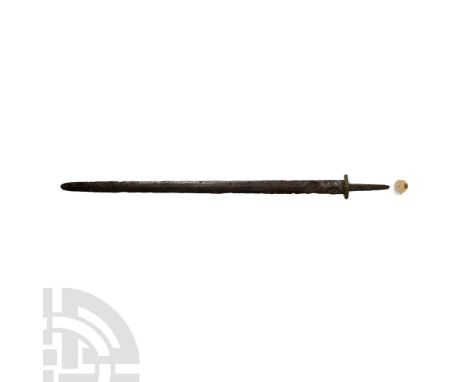 5th-6th century A.D.. Comprising a double-edged blade with pointed tip, battle nicks to both cutting edges; short bronze guar