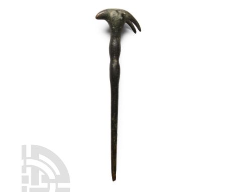 9th-8th century B.C.. With a tapering round-section shank, finial topped with a ram's head. See Muscarella, O.W., Bronze and 