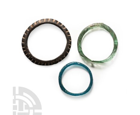 3rd-4th century A.D.. Comprising: a turquoise D-section bangle with a flattened panel to the upper face; an opaque round-sect