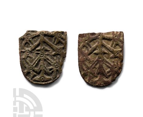 10th-11th century A.D.. Two tongue-shaped panels forming two of the three arms of a trefoil brooch; each with a low-relief de