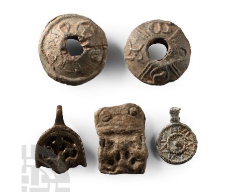 6th-11th century A.D.. Including three biconvex spindle whorls with low-relief detailing, a bronze hooked tag and other items