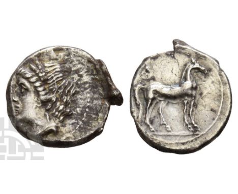 Circa 215-205 BC.. Head of Tanit to left, wearing wreath of grain ears and single pendant earring / Horse standing to right. 