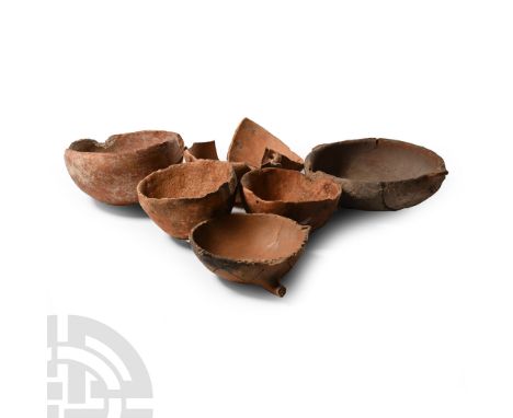 Bronze Age, 2300-1650 B.C.. Mainly hemispherical types with round rim, one with stub handle; mostly repaired.  876 grams tota