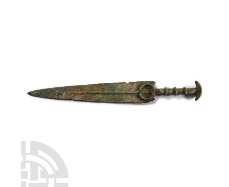 14th-10th century B.C.. A short sword or dagger with slender triangular blade, low round midrib with flat upper face, annular