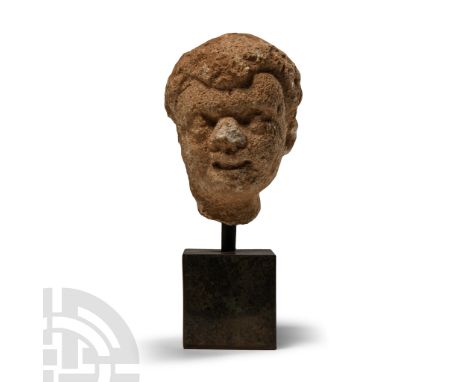 2nd-4th century A.D.. With wavy hair and large lentoid eyes, rounded facial features; mounted on a custom-made stand. Cf. Jon