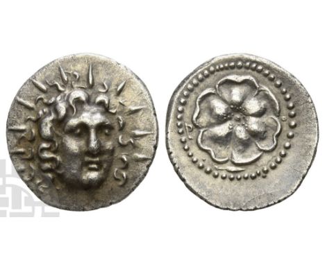 Circa 88/42 BC-AD 14.. Radiate head of Helios facing slightly to the right / Rose seen from above; below, corn ear to right; 