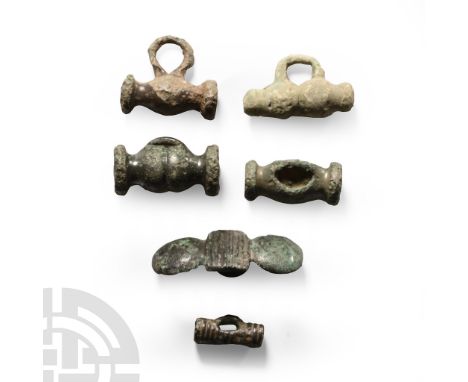 1st century B.C.-1st century A.D.. Including barrel-shaped type with disc finials, central bar with lateral domes and other t