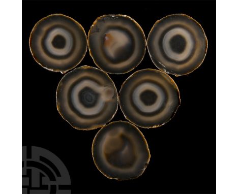 Comprising six polished slices displaying black and brown banding, from Brazil, collection number 275.  390 grams total, 83-9