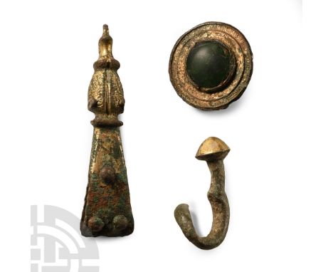 6th-15th century A.D.. Comprising: a 6th century Dark Age round gilded brooch; a 15th century medieval bronze swivel hook wit
