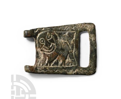 6th-8th century A.D.. Rectangular belt-buckle plaque with hinge knuckles and slotted rear; low-relief panel with advancing li