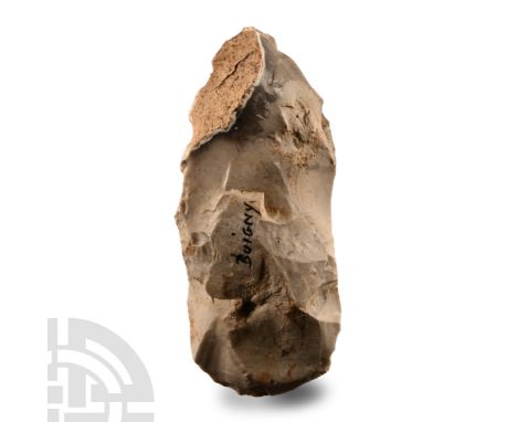 Neolithic Period, circa 3000-2000 B.C.. Round-butted axehead with cortex to edge and both faces; marked 'BUIGNY'. Cf. MacGreg