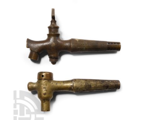 19th century A.D.. Group of two beer-keg taps each with a ribbed spile and lateral vents.  605 grams total, 14.7 - 15.4 cm (5