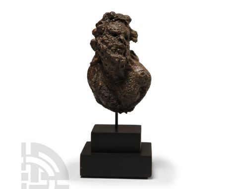 1st century A.D.. Modelled in the round with open reverse at the shoulders and chest; the bearded head turned towards the lef