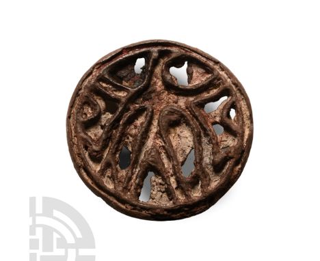 23rd-19th century B.C.. Openwork discoid seal with anthropomorphic motif; accompanied by an old scholarly note, typed and sig