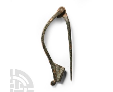 1st century A.D.. With shallow bow and hinged pin to the reverse, scooped foot with knop finial; Aucissa type. Cf. Bayley, J.