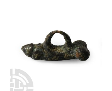 1st-3rd century A.D.. Comprising a thick, elongated body with lateral testes, thin suspension loop above. Cf.Beutler, F. et a