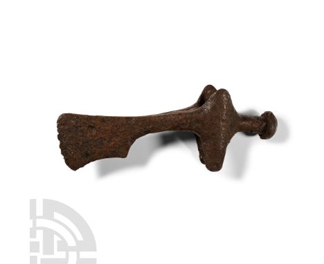 11th-12th century A.D.. A hand-forged iron axehead with square chin to the blade, flanges raised to the socket, rear round ha