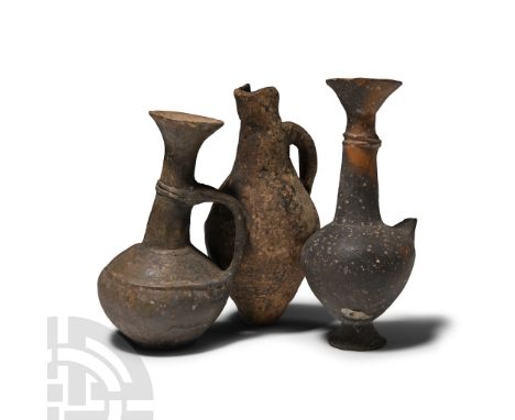 Middle-Late Bronze Age, 2000-1200 B.C.. Comprising: biconvex juglet with loop handle and U-shaped lip; two with trumpet-shape