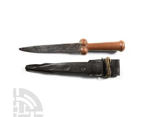 15th century A.D. and later. The tapering blade with a single cutting edge; replica leather scabbard decorated with 'fleur de