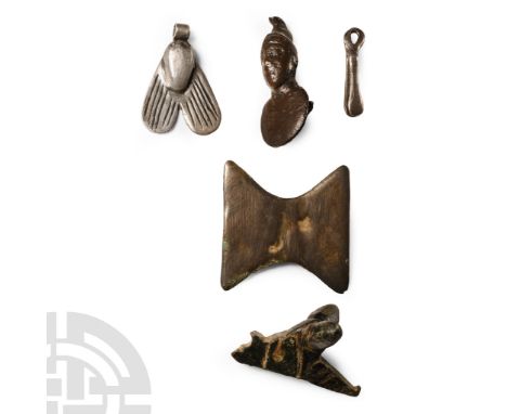 1st millennium B.C.-4th century A.D.. Comprising: amuletic pendant in the form of a fly with hatched wings; amuletic wishbone