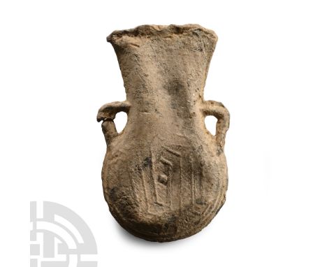 14th-15th century A.D.. With lateral angle handles and low-relief 'IHS' monogram to one face of the bulb, hatched design to t