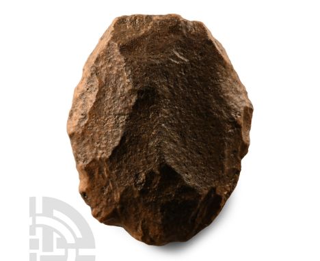 Lower Palaeolithic Period, circa 1000,000-500,000 B.P.. Lentoid in section with irregular rounded edge and desert patina. Cf.