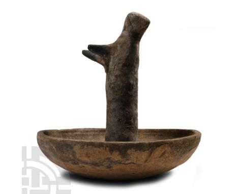 Late Bronze Age, 1200-750 B.C.. Broad bowl with rounded rim, central column with bird in flight finial with black painted det