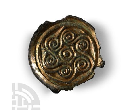 6th century A.D.. With raised flange rim, tondo with raised border and six spirals with connecting tendrils around a central 