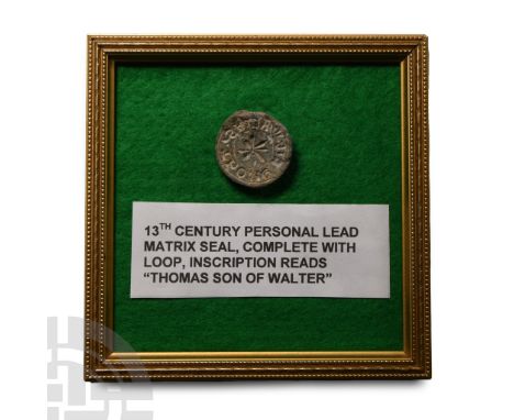 13th-14th century A.D.. Discoid in shape with central eight-petalled flower within a roundel, surrounding 'S’ THOME FIL WALTE