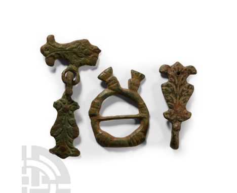 15th-16th century A.D.. Comprising an annular ring-tie with fringed ends, and two belt-hooks with a ring and plate attached. 