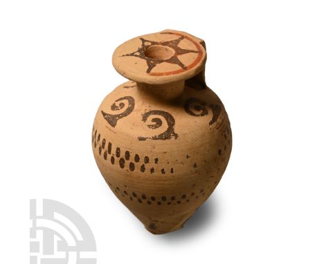 Circa 600-550 B.C.. Bulbous vessel with narrow neck, broad rim to the mouth and short strap handle to the rear; circumferenti