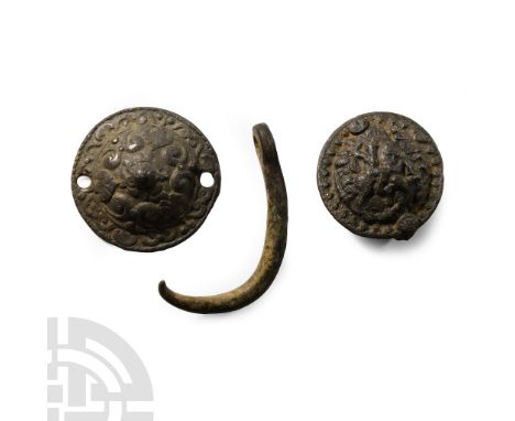16th century A.D.. Comprising a disc mount with domed centre and high-relief scrolled foliage, and a substantial pin with rin