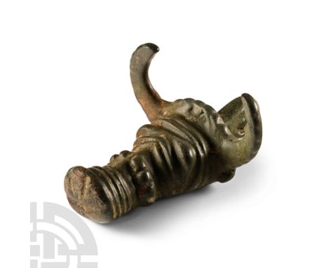 1st century B.C.-1st century A.D.. D-section bull-head finial with hollow to the underside, segmented ring to the muzzle and 