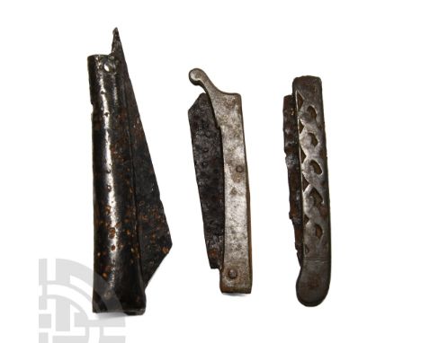 15th-17th century A.D.. Including one with folded tubular handle and another shaped like a ship with curved prow. Cf. Bailey,