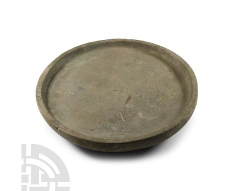 1st millennium B.C.. Discoid in plan with basal ring and shallow dished face.  2.05 kg, 21.7 cm wide (8 1/2 in.). From a coll