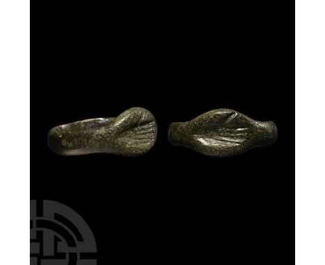 2nd-3rd century A.D.. Wide hoop expanding to an oval-shaped intaglio with open hand.  3.18 grams, 20.88 mm overall, 17.14 mm 