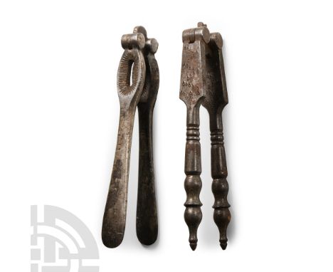 Circa 19th century A.D.. Comprising two nut crackers, consisting of two arms hinged at the top, one with ring design on the h