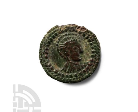 9th-10th century A.D.. Disc brooch with pin-lug to the reverse and scar where the catch was soldered on, low-relief design of