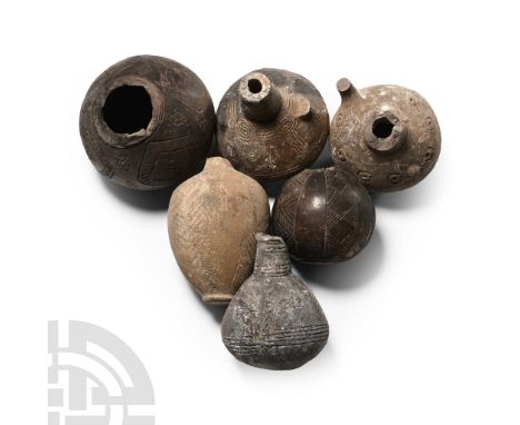 Bronze Age, 2300-1650 B.C.. Mainly spherical with stub neck, incised detailing.  560 grams total, 57-87 mm (2 1/4 - 3 3/8 in.