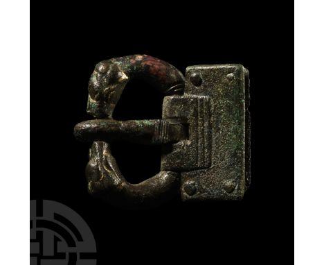 11th-12th century A.D.. With rectangular plate, D-section tongue curved over the forward edge of the loop formed as two oppos