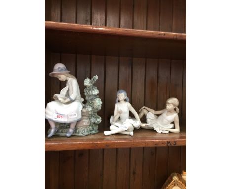 A Nao figure "Girl on the bench" and two Nao ballerinas 