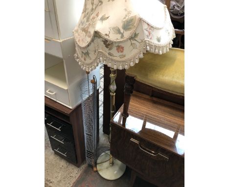 An onyx and brass effect standard lamp. 