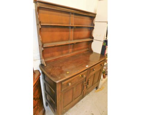An Ercol dark oak finish dresser.  