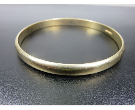 GOLD BANGLE, heavy gold bangle stamped "CC & S", Birmingham hallmark, 9ct, 26.1 grams 