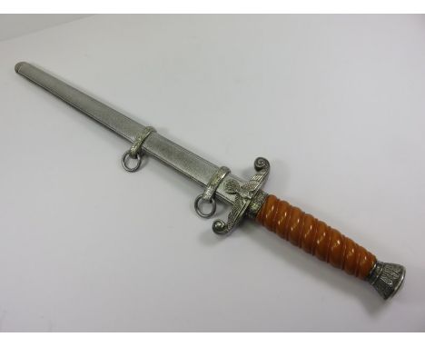 GERMAN MILITARY, a WWII German Third Reich army dagger with blade by W K C, plated sheath and fittings, with dark orange grip