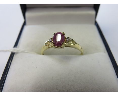 RUBY & DIAMOND RING, oval ruby flanked by diamonds on a 9ct yellow gold mount, size N/O