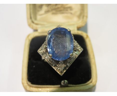 IMPRESSIVE SAPPHIRE & DIAMOND RING, large oval cushion cut pale sapphire ring surrounded by diamonds, on 18ct white gold moun